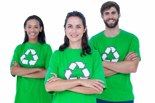 Workers wearing PPE while sorting green waste